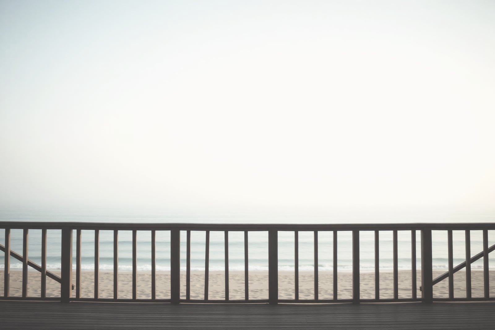 Early morning light on a quiet pier over calm water